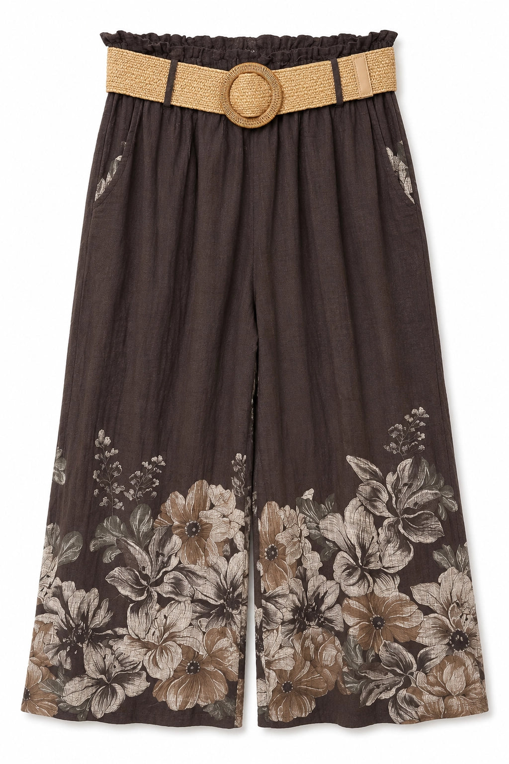 A pair of dark brown wide-leg cropped pants featuring a large beige and brown floral print along the bottom hem, styled with a matching woven tan belt with a round wooden-style buckle.