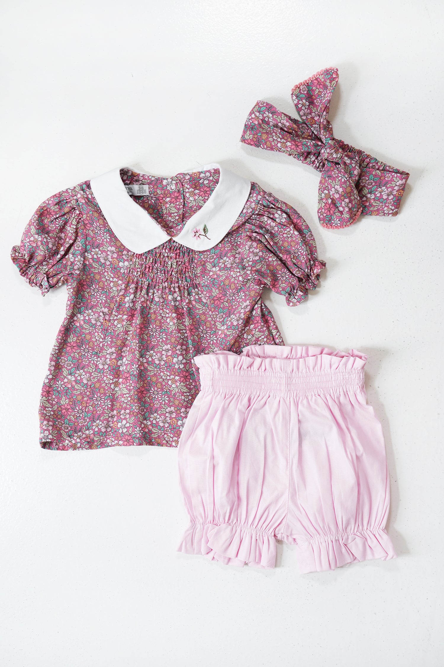 Mila Shorts Set baby outfit with floral top, pink shorts and matching bow