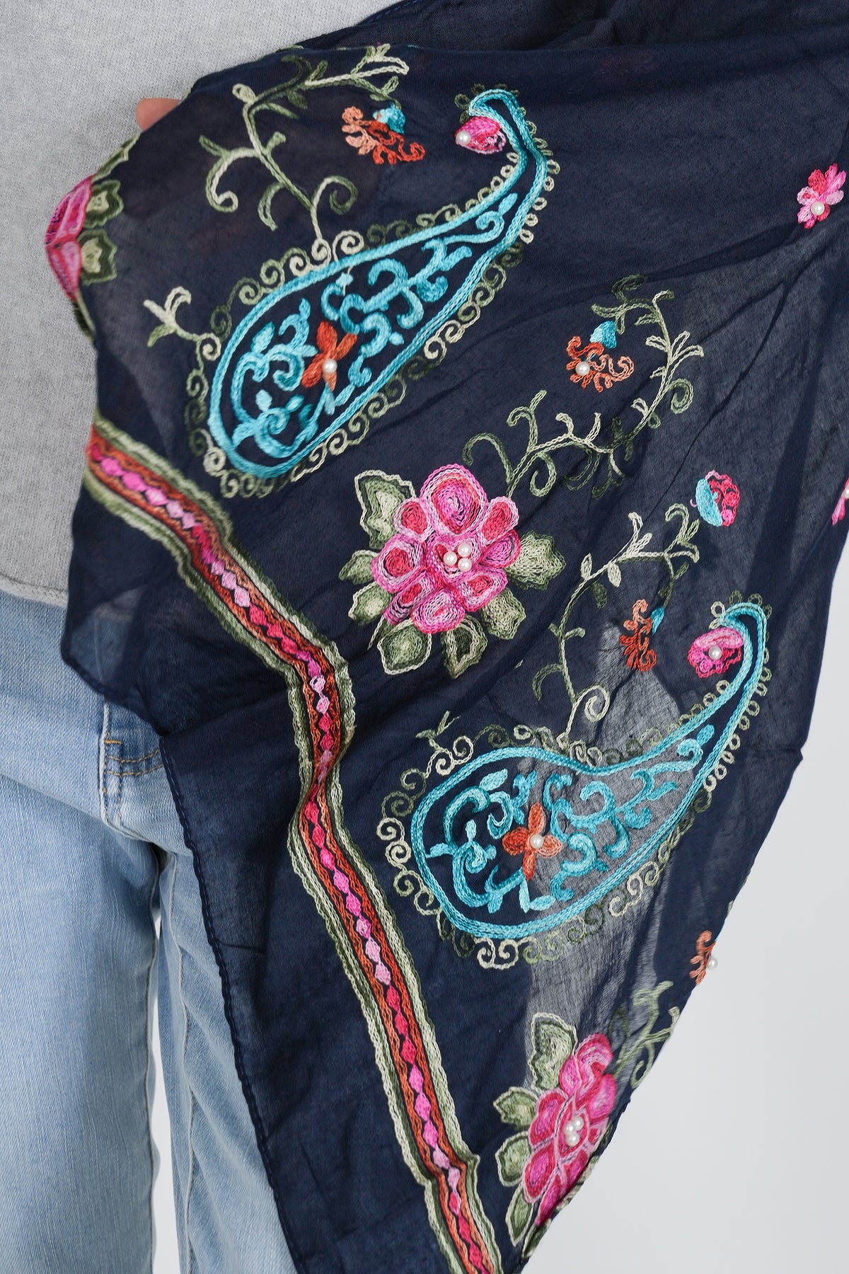 Close up of embroidered black scarf