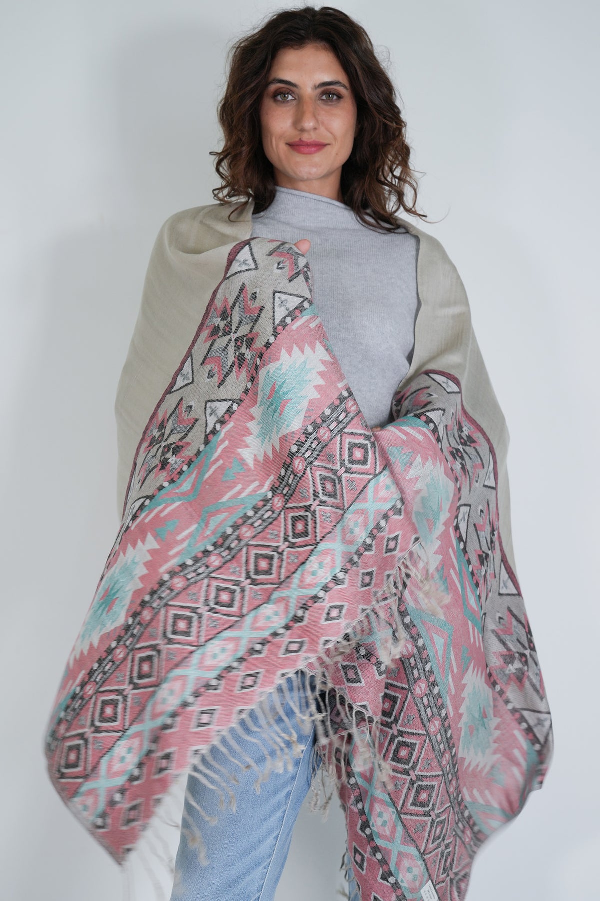 Woman wearing a patterned scarf with a white background