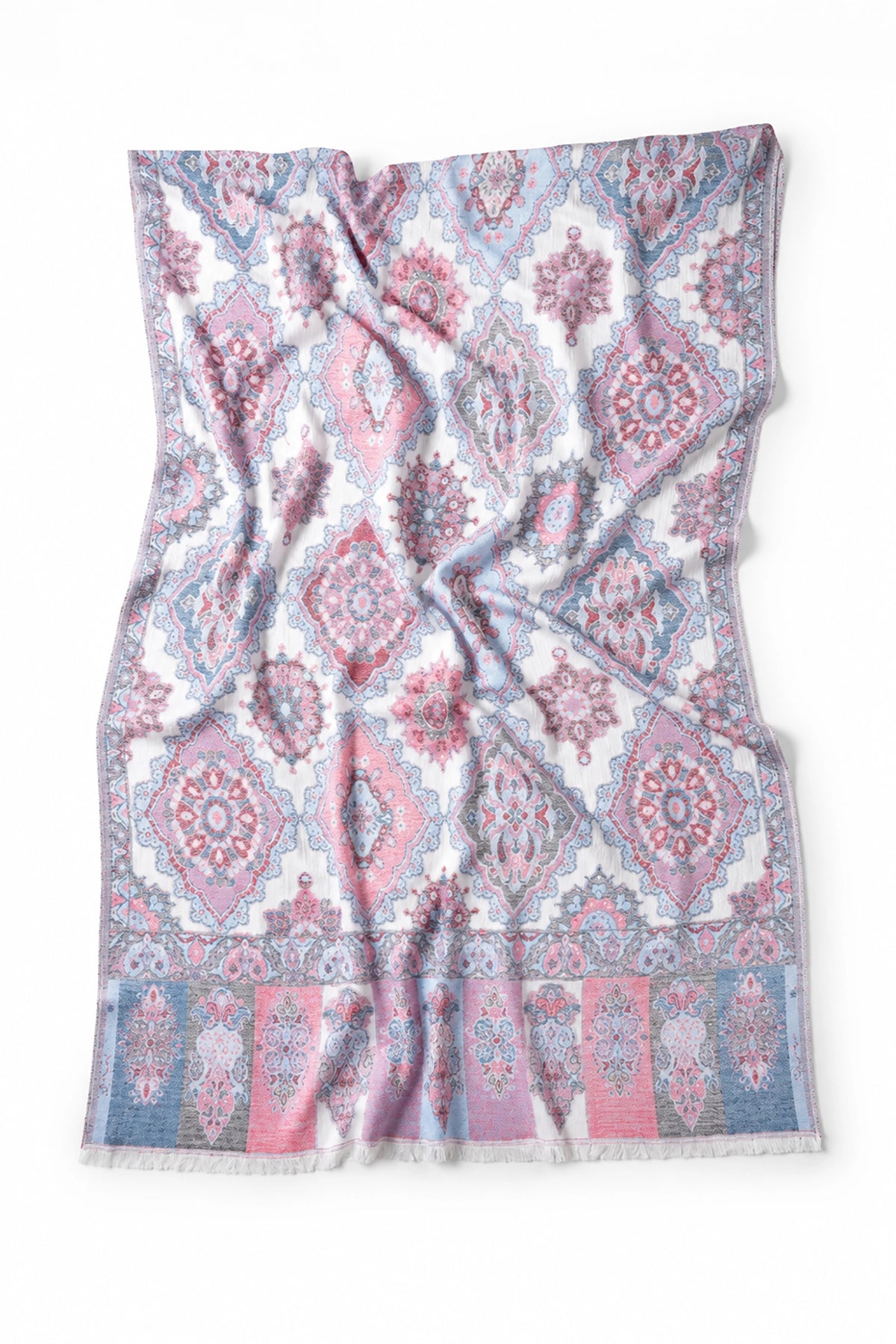 Patterned fabric with pink and blue design on a white background