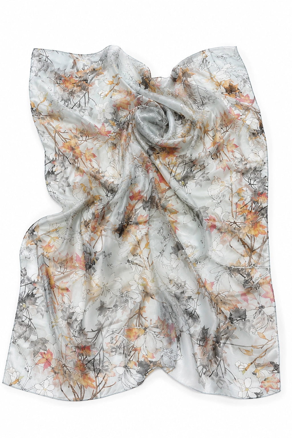 A lightweight white scarf with an abstract watercolor-style print in gray, orange, and brown, draped to show its soft texture and pattern.