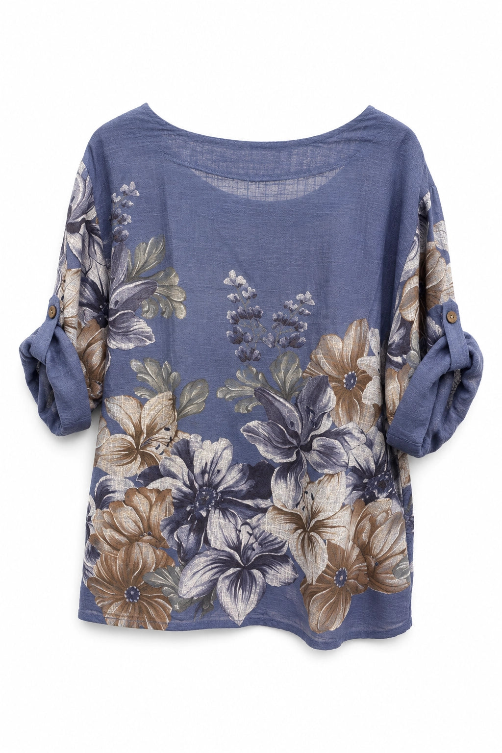 A women's loose-fitting blouse in dusty blue with a large floral print in beige, brown, and white, featuring rolled three-quarter sleeves with button details.