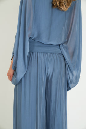Blue dress with a plain background