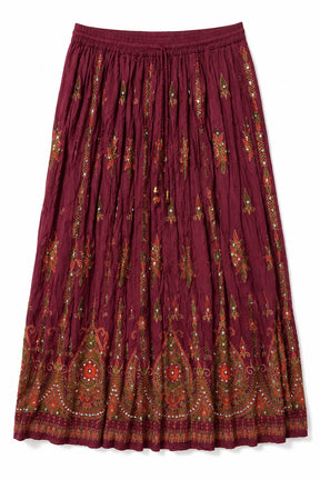 A pleated midi skirt in deep burgundy with intricate multicolor embroidery and paisley patterns, shown flat against a white background.