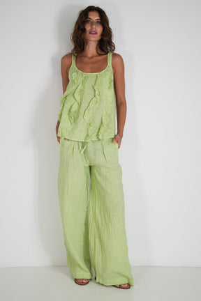 Woman wearing a green outfit against a white background