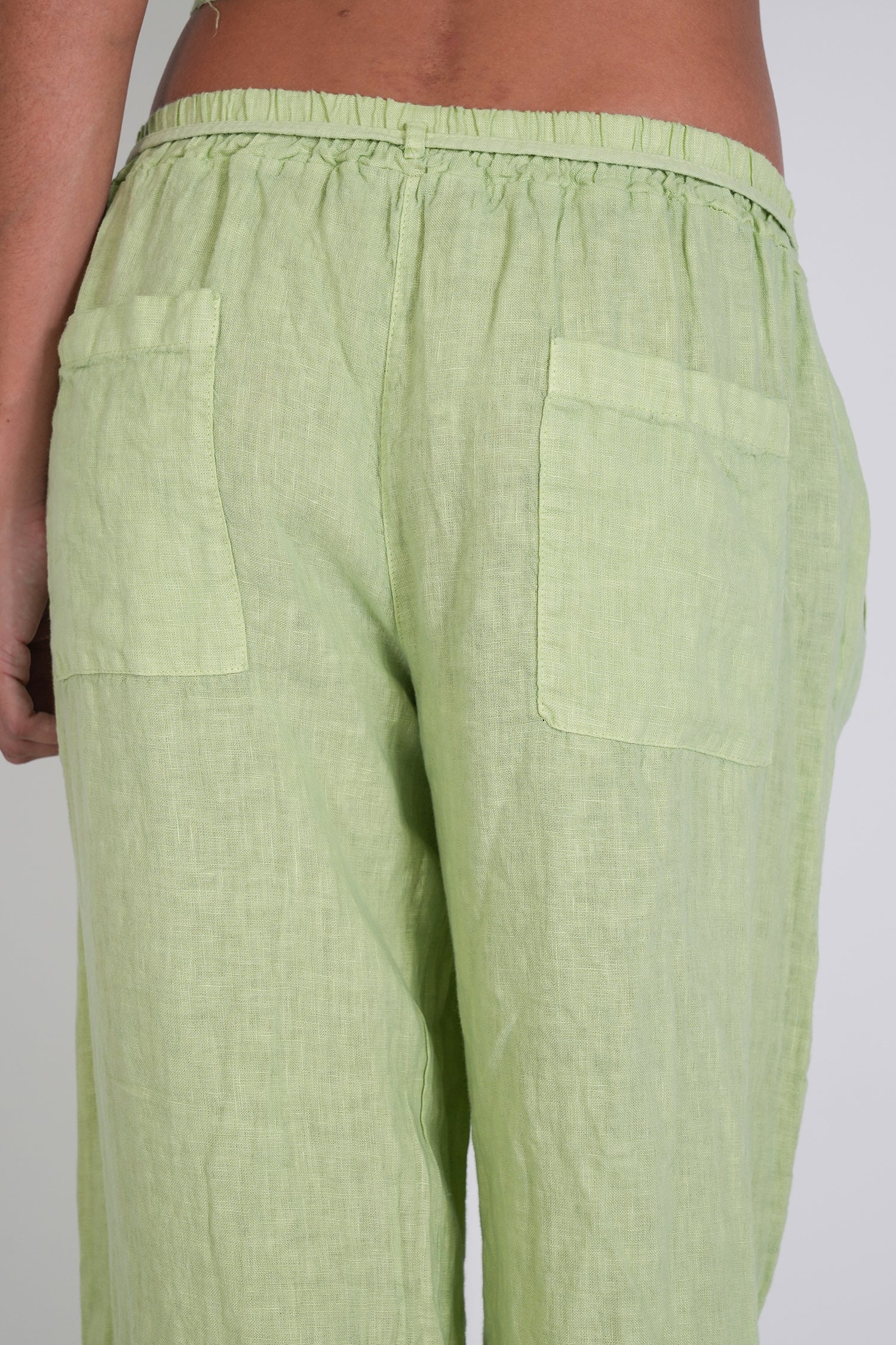 Light green pants with a plain background