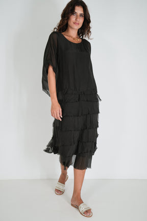 Women wearing flowing black dress