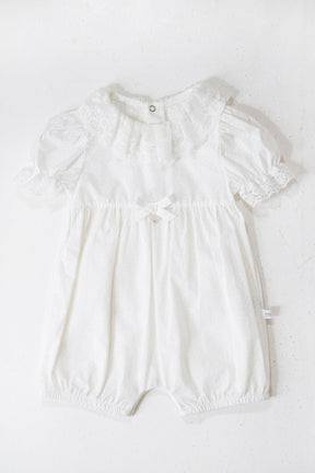 White baby romper on a white background