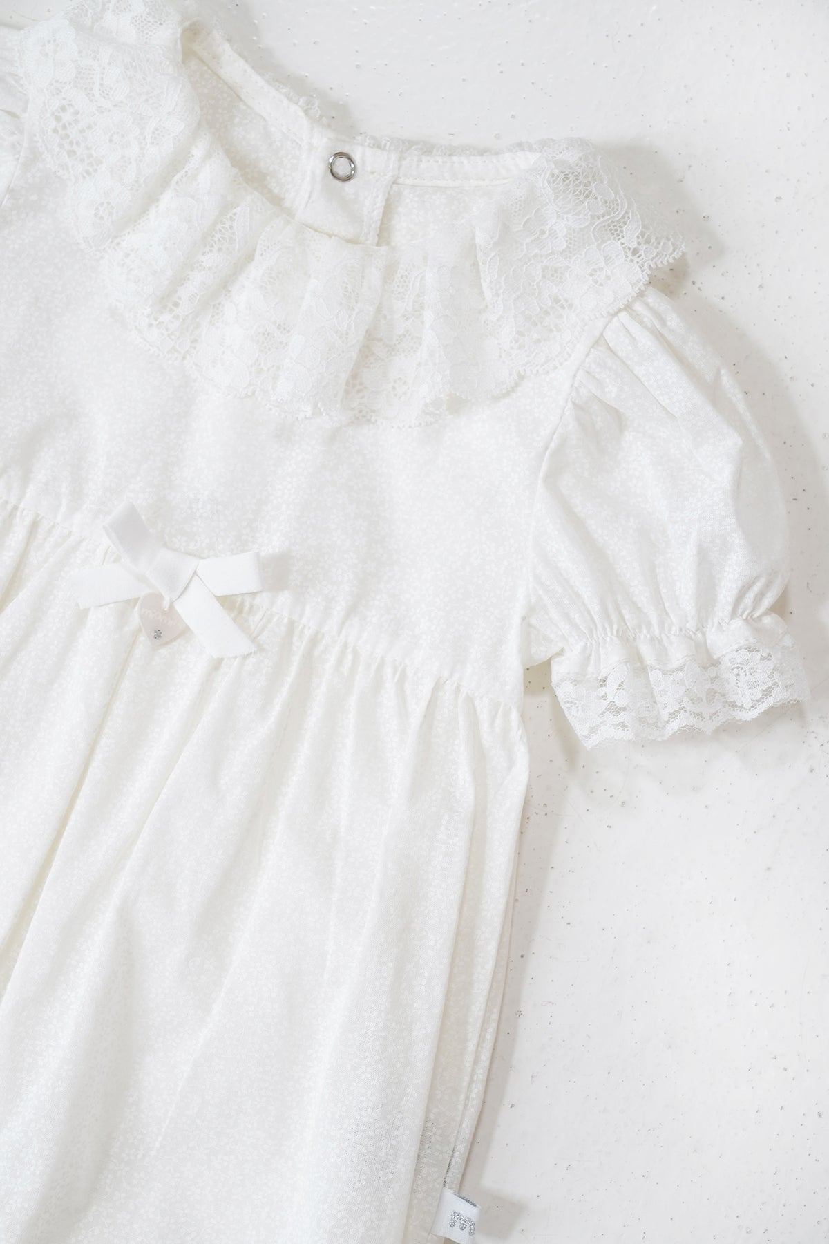 White lace dress on a white background