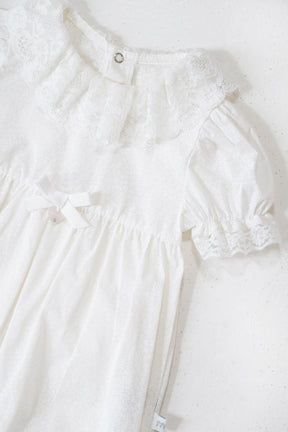 White lace dress on a white background