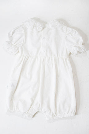 White baby romper on a white background