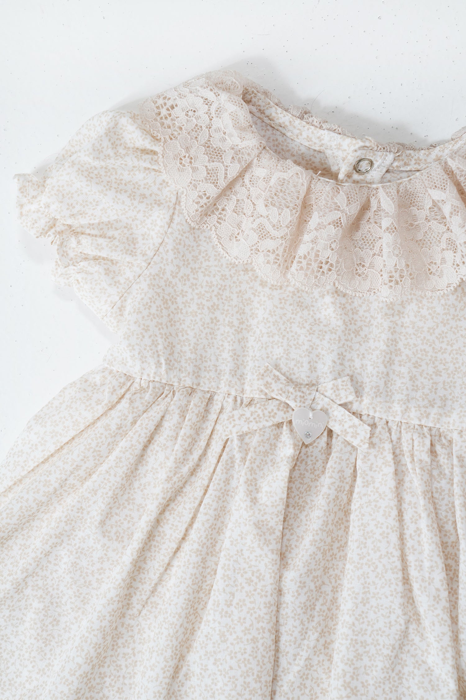 White lace dress on a white background