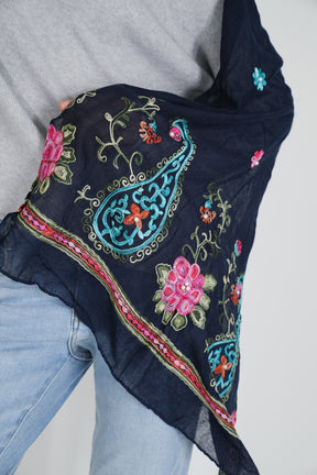 Close up of black scarf with pink and blue floral patterns