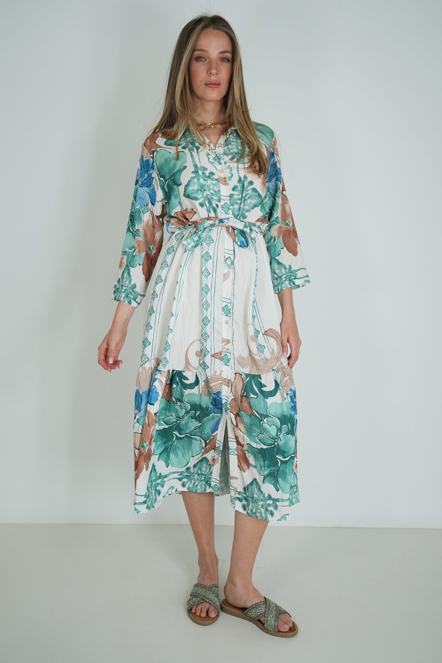 Woman wearing a floral dress with a white background