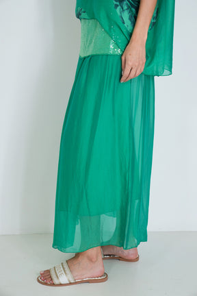 Green dress with a plain white background