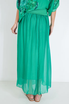 Green dress with floral sleeves on a white background