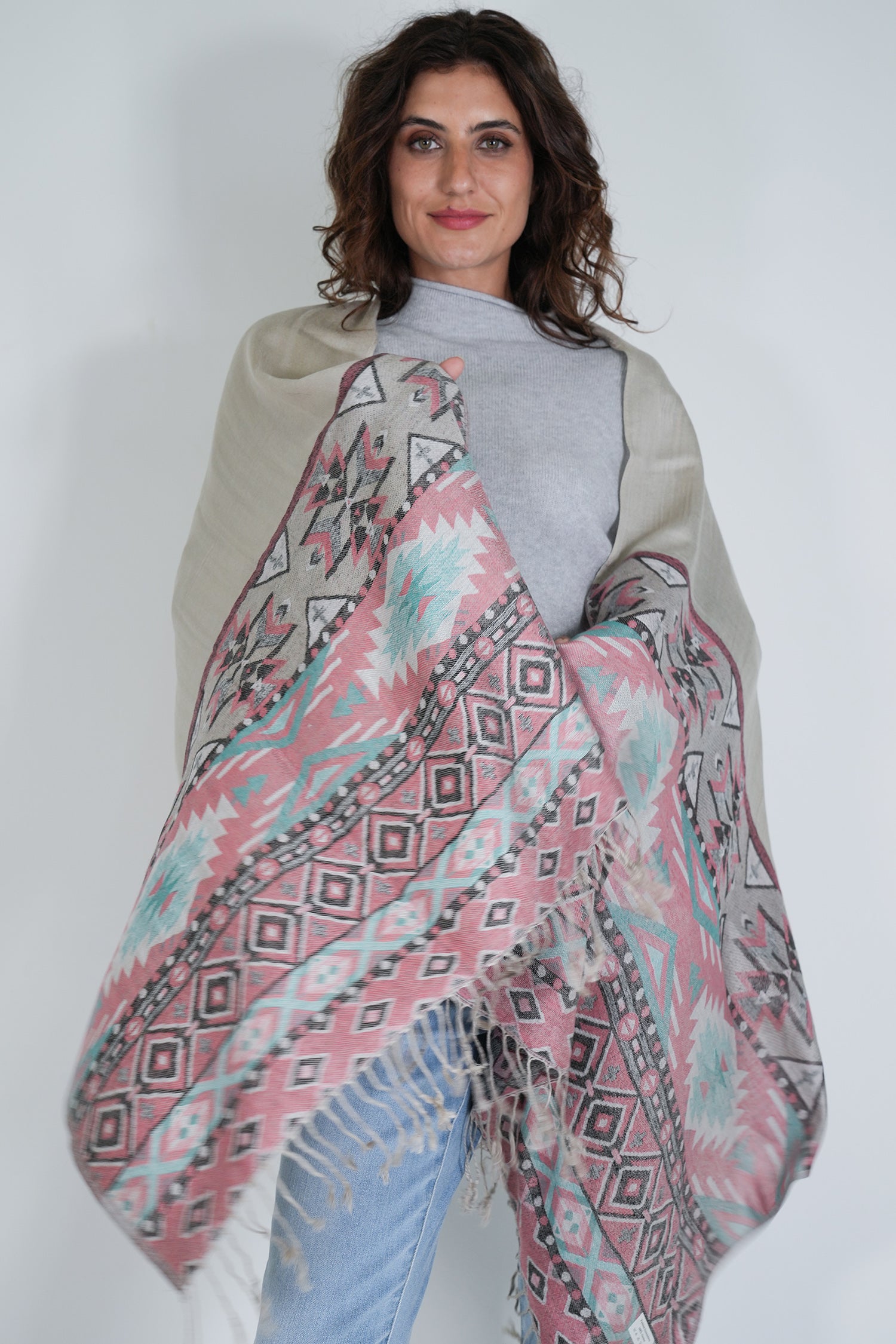 Woman wearing a patterned scarf with a white background