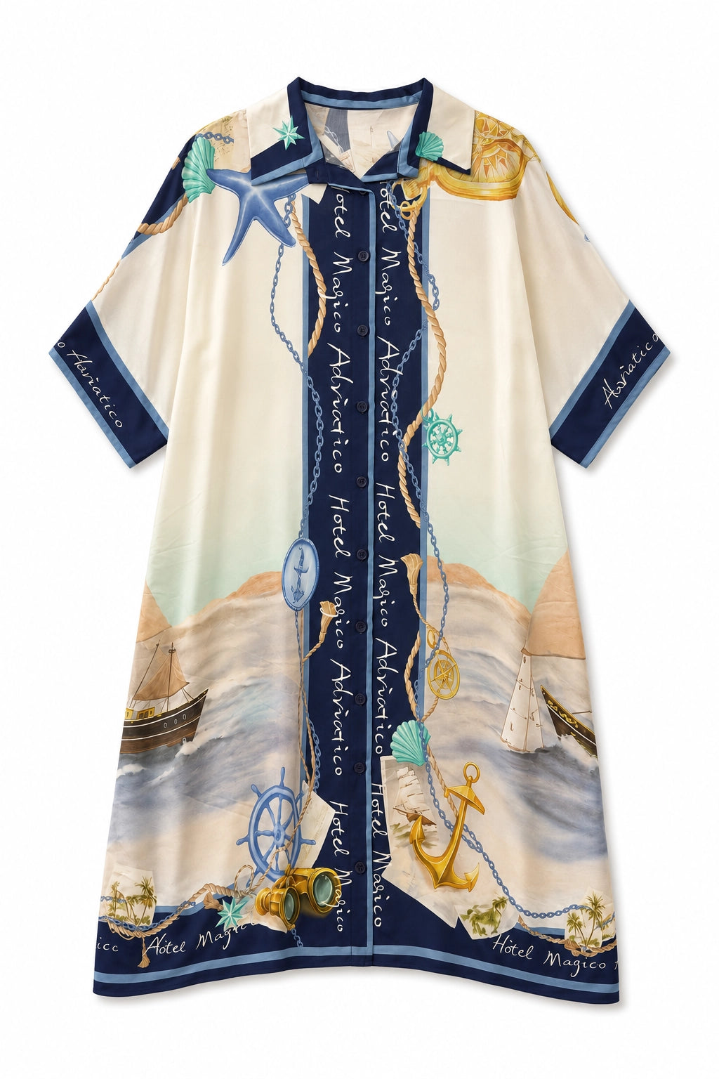 A short-sleeve kaftan-style tunic dress featuring a nautical print with ships, anchors, starfish, seashells, and ocean waves. The design has a cream base with navy blue borders and text, along with gold, blue, and beige accents.