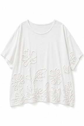 A white short-sleeve crewneck top with raised floral embroidery on the front, displayed flat against a white background.