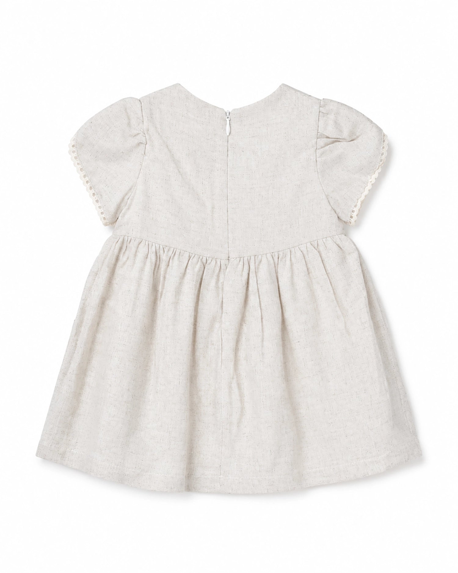 White baby dress with ruffled sleeves on a white background