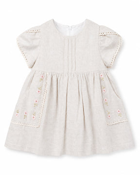 Baby dress with floral embroidery on a white background