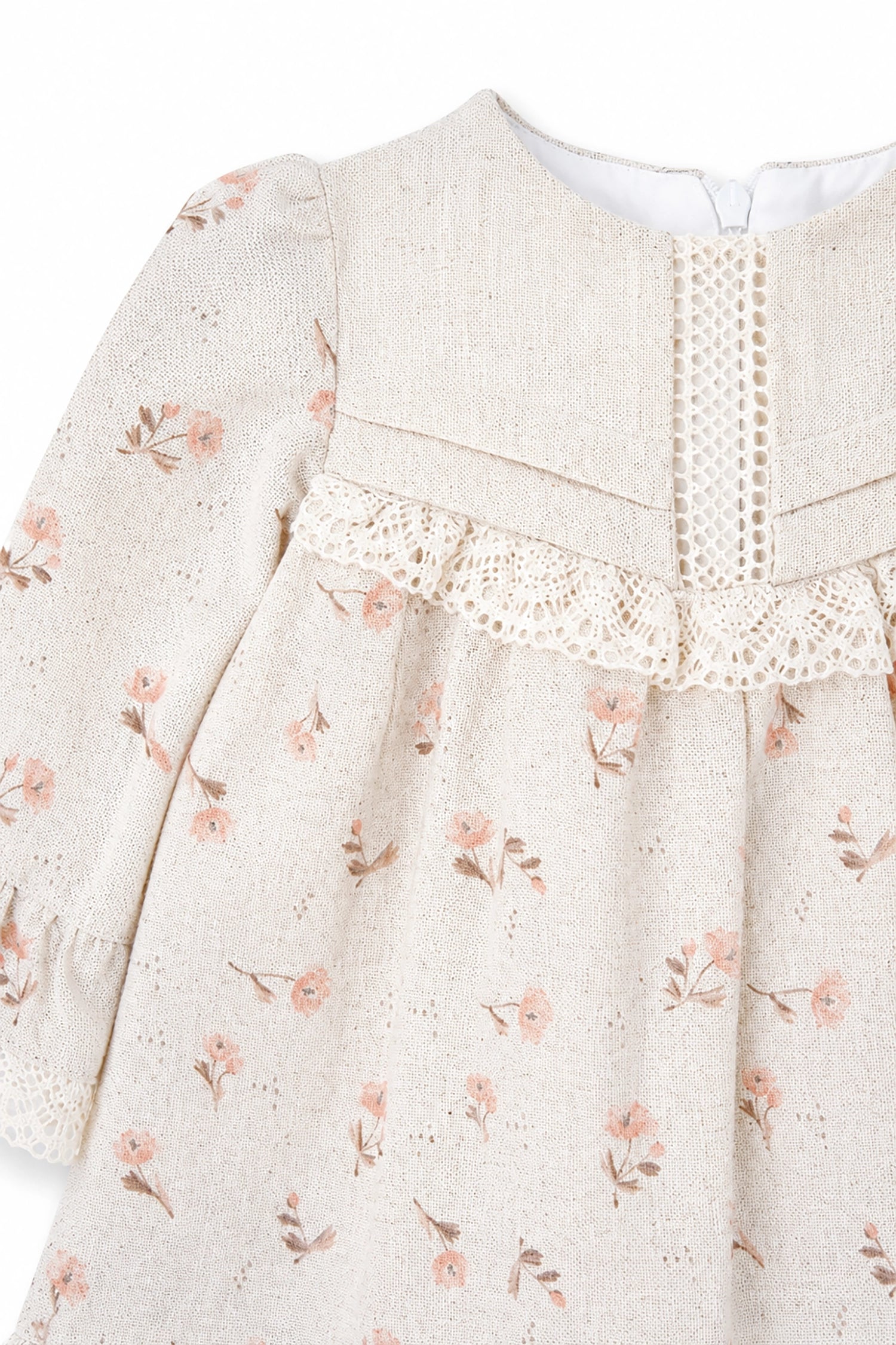 Floral patterned dress with lace detail on a white background