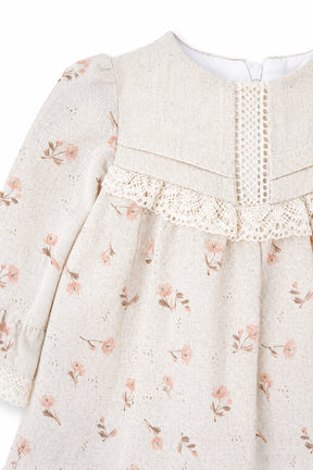 Floral patterned dress with lace detail on a white background
