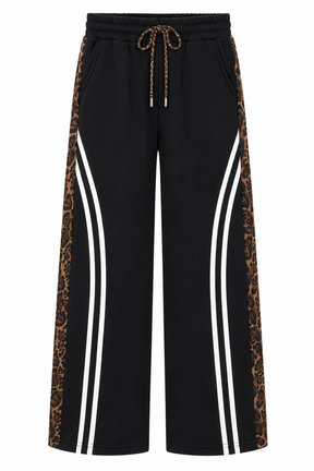 Black pants with leopard print side panels and white stripes on a white background