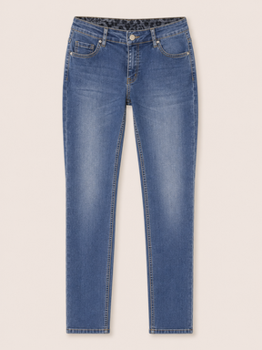 Blue jeans on a light beige background