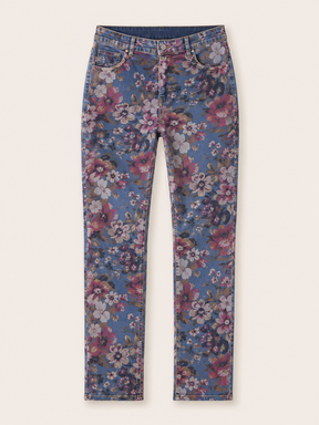 Floral patterned jeans on a white background