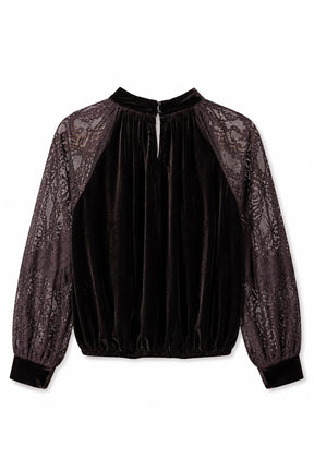 Black blouse with sheer sleeves on a white background