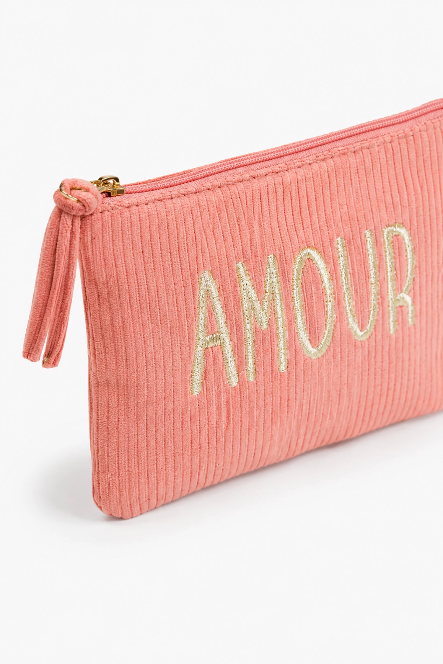 coral pouch with 'AMOUR' embroidery on a white background