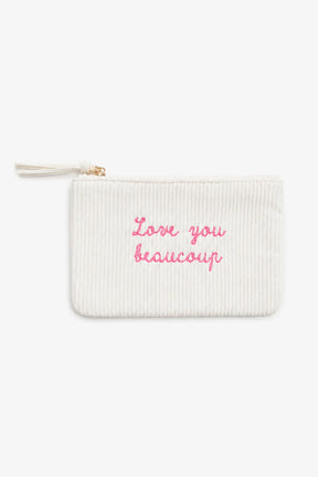 White pouch with pink text 'Love you beaucoup' on a white background