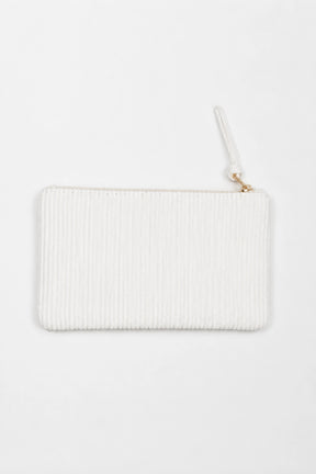 White ribbed clutch bag on a white background