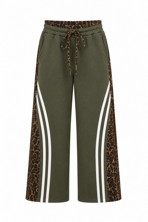 Green pants with leopard print and white stripes on a white background