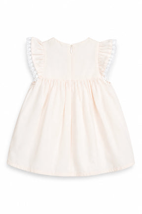 peach dress with lace details on a white background