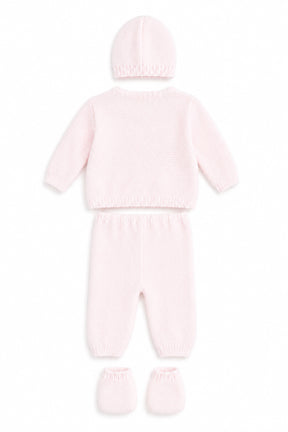 Pink baby outfit with hat, onesie, and booties on a white background