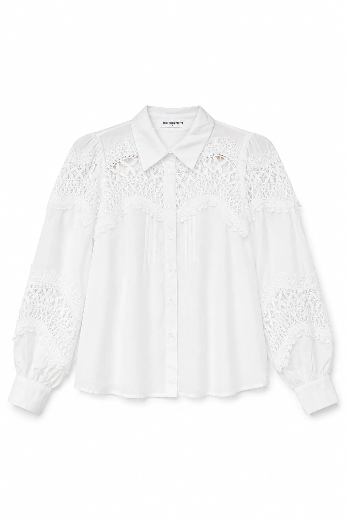 White blouse with lace details on a white background